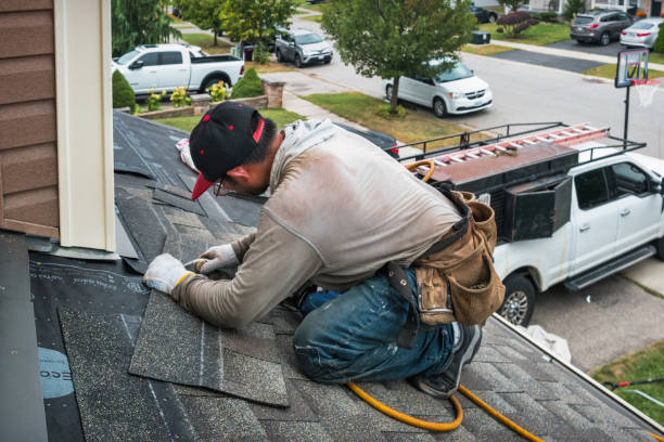 Professional Roofing technician working in Teton, ID